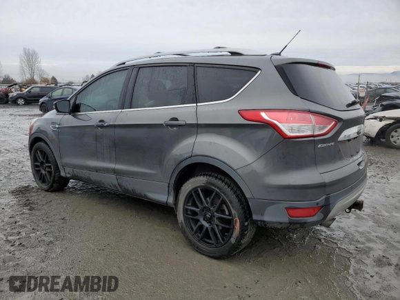 2015 Ford Escape Titanium with VIN 1FMCU9J92FUA62323, listed as a Copart auction lot 85826724 with 108,315 mi miles and Salvage Title. Bid and sale history available at DreamBid. Image 2.