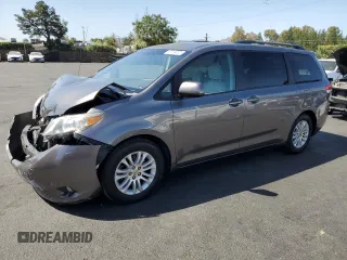 2011 Toyota Sienna XLE AAS with VIN 5TDYK3DC6BS077927, listed as a Copart auction lot 60516555 with 190,699 mi miles and Salvage title. Bid and sale history available at DreamBid. Image 1.