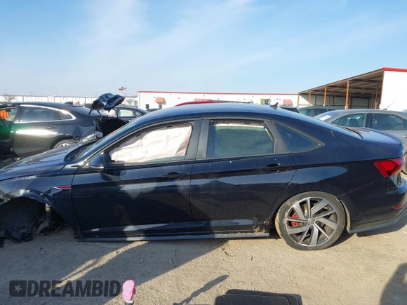 2019 Volkswagen Jetta GLI S z VIN 3VW5T7BU3KM245927, wystawiony jako IAAI lot #41573257 z przebiegiem 57 322 mil mil oraz . Historia ofert i sprzedaży dostępna na DreamBid. Obrazek 15.