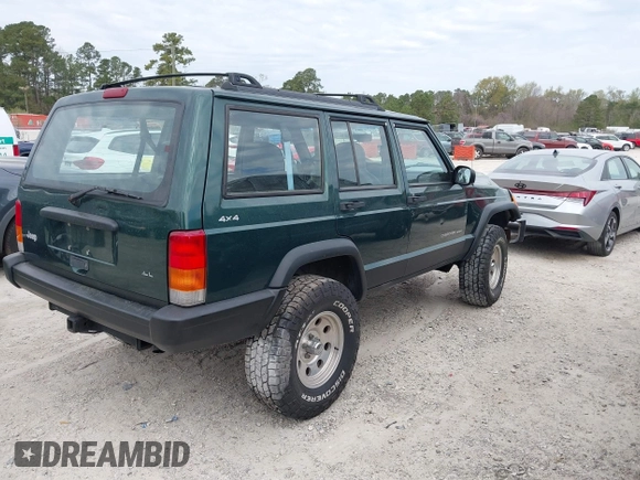 1999 Jeep Cherokee Sport with VIN 1J4FF68S1XL555463, listed as a IAAI auction lot 41898076 with 206,656 mi miles. Bid and sale history available at carsss.com. Image 4.