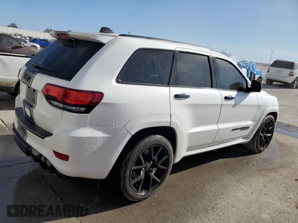 2019 Jeep Grand Cherokee Trackhawk with VIN 1C4RJFN92KC564748, listed as a Copart auction lot 82677504 with 48,528 mi miles and Salvage title. Bid and sale history available at DreamBid. Image 3.