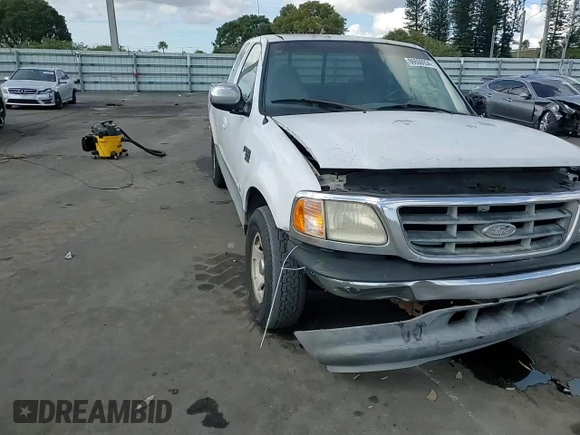 2000 Ford F-150 XL with VIN 1FTRX17W2YNB05575, listed as a Copart auction lot 86606934 with 0 mi miles and Salvage Title. Bid and sale history available at carsss.com. Image 10.