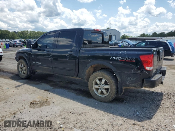 2011 Nissan Titan Pro-4X with VIN 1N6BA0EC6BN313680, listed as a Copart auction lot 60335995 with 241,301 mi miles and Salvage title. Bid and sale history available at DreamBid. Image 2.