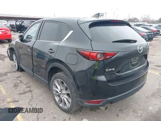 2020 Mazda CX-5 Grand Touring with VIN JM3KFADM8L0811910, listed as a IAAI auction lot 41446214 with 57,849 mi miles. Bid and sale history available at carsss.com. Image 3.