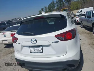 2013 Mazda CX-5 Touring with VIN JM3KE2CE0D0119032, listed as a IAAI auction lot 41891556 with 174,745 mi miles and . Bid and sale history available at carsss.com. Image 16.