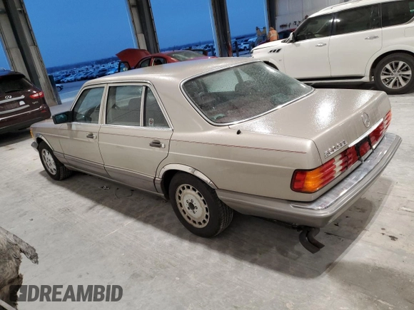 1990 Mercedes-Benz 560 with VIN WDBCA39E7LA517710, listed as a Copart auction lot 85307074 with 225,233 mi miles and Salvage Title. Bid and sale history available at DreamBid. Image 2.