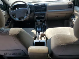 2000 Isuzu Rodeo S with VIN 4S2DM58WXY4302769, listed as a Copart auction lot 70416054 with 150,621 mi miles and Salvage Title. Bid and sale history available at DreamBid. Image 8.