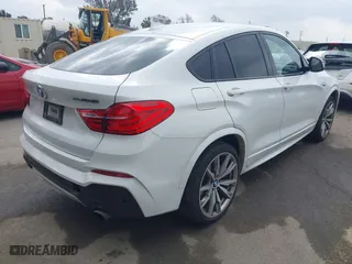 2017 BMW X4 M40i with VIN 5UXXW7C59H0M91384, listed as a IAAI auction lot 41883585 with 163,547 mi miles. Bid and sale history available at carsss.com. Image 4.