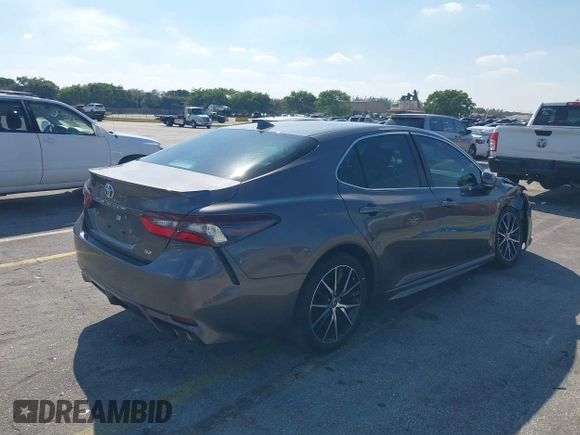 2023 Toyota Camry SE with VIN 4T1G11AK1PU809099, listed as a IAAI auction lot 41450292 with 128,099 mi miles. Bid and sale history available at carsss.com. Image 4.
