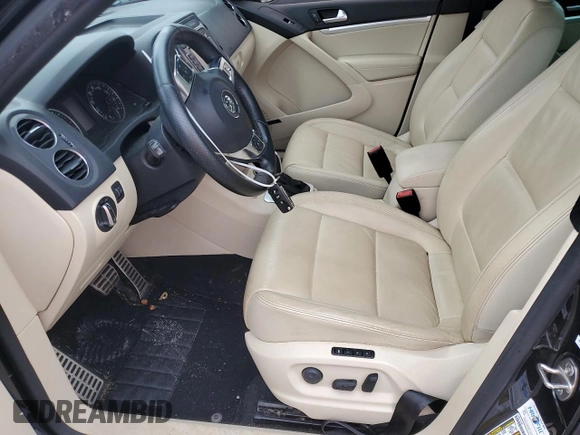 2014 Volkswagen Tiguan SEL with VIN WVGAV3AX7EW101796, listed as a Copart auction lot 60904345 with 97,652 mi miles and Salvage title. Bid and sale history available at DreamBid. Image 7.