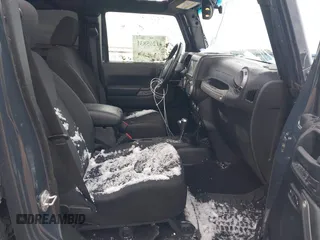 2017 Jeep Wrangler Unlimited Sport with VIN 1C4BJWDG4HL748681, listed as a IAAI auction lot 41265831 with 76,169 mi miles. Bid and sale history available at carsss.com. Image 5.