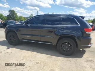 2015 Jeep Grand Cherokee Summit with VIN 1C4RJFJG6FC828922, listed as a Copart auction lot 54878415 with 125,781 mi miles and Salvage title. Bid and sale history available at DreamBid. Image 2.