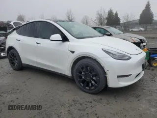 2021 Tesla Model Y Long Range with VIN 5YJYGDEE1MF267004, listed as a Copart auction lot 88708485 with 65,669 mi miles and Salvage Title. Bid and sale history available at DreamBid. Image 4.