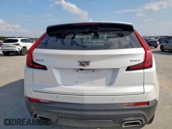 2021 Cadillac XT4 FWD Luxury z VIN 1GYAZAR49MF084676, wystawiony jako Copart lot #59765515 z przebiegiem 32 480 mil mil oraz Czysty tytuł • Clean title. Historia ofert i sprzedaży dostępna na DreamBid. Obrazek 6.