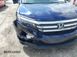 2018 Honda Pilot EX-L with VIN 5FNYF5H5XJB025960, listed as a IAAI auction lot 41843520 with 23,404 mi miles and . Bid and sale history available at DreamBid. Image 17.