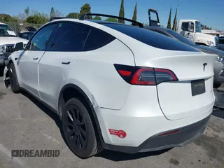 2023 Tesla Model Y Long Range with VIN 7SAYGDEEXPA152986, listed as a IAAI auction lot 41946665 with 13,574 mi miles and . Bid and sale history available at carsss.com. Image 3.