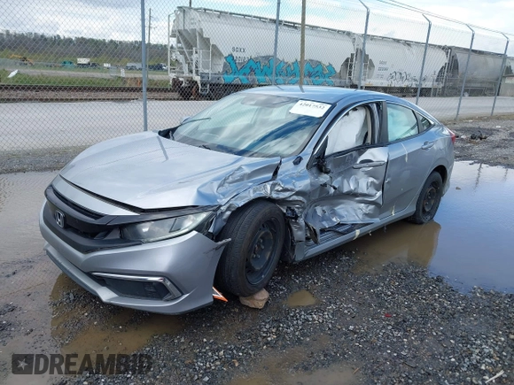 2019 Honda Civic LX with VIN 19XFC2F61KE009471, listed as a IAAI auction lot 42017532 with 81,134 mi miles and . Bid and sale history available at DreamBid. Image 17.