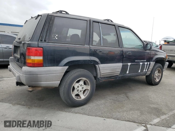 1998 Jeep Grand Cherokee Laredo with VIN 1J4FX58S0WC305329, listed as a Copart auction lot 76777264 with 251,942 mi miles and Clean Title. Bid and sale history available at carsss.com. Image 3.