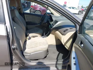 2014 Hyundai Accent GLS z VIN KMHCT4AE9EU671748, wystawiony jako IAAI lot #42356469 z przebiegiem 179 390 mil mil oraz . Historia ofert i sprzedaży dostępna na DreamBid. Obrazek 5.