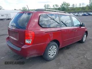 2012 Kia Sedona LX with VIN KNDMG4C76C6453523, listed as a IAAI auction lot 42189376 with 207,557 mi miles and . Bid and sale history available at carsss.com. Image 4.