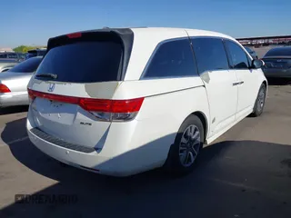 2014 Honda Odyssey Touring with VIN 5FNRL5H97EB037361, listed as a IAAI auction lot 42106742 with 198,279 mi miles and . Bid and sale history available at DreamBid. Image 4.