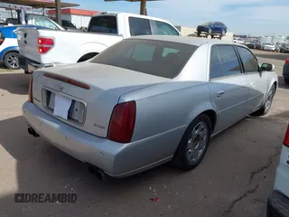 2002 Cadillac DeVille DTS with VIN 1G6KF57972U262315, listed as a IAAI auction lot 41537606 with 151,664 mi miles. Bid and sale history available at carsss.com. Image 4.