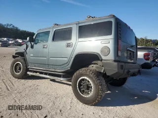 2005 Hummer H2 SUV with VIN 5GRGN23U25H115698, listed as a Copart auction lot 82569874 with 143,367 mi miles and Salvage Title. Bid and sale history available at carsss.com. Image 2.