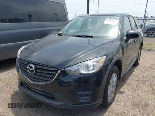 2016 Mazda CX-5 Sport with VIN JM3KE2BY8G0847018, listed as a IAAI auction lot 42064726 with 69,017 mi miles and . Bid and sale history available at DreamBid. Image 2.