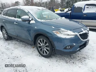 2014 Mazda CX-9 Grand Touring with VIN JM3TB3DV0E0436540, listed as a IAAI auction lot 41476669 with 157,255 mi miles and . Bid and sale history available at DreamBid. Image 1.