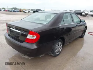 2002 Toyota Camry LE z VIN JTDBE32K720119418, wystawiony jako IAAI lot #42360721 z przebiegiem 235 678 mil mil oraz . Historia ofert i sprzedaży dostępna na DreamBid. Obrazek 4.