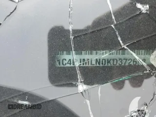 2019 Jeep Cherokee Latitude Plus z VIN 1C4PJMLN0KD372668, wystawiony jako Copart lot #60802365 z przebiegiem Nie podano mil oraz Szkoda całkowita • Salvage title. Historia ofert i sprzedaży dostępna na DreamBid. Obrazek 14.