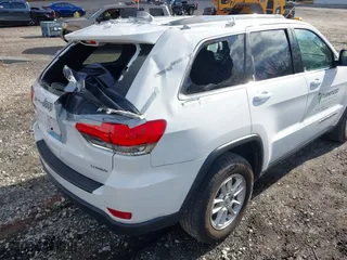 2018 Jeep Grand Cherokee Laredo E with VIN 1C4RJFAG8JC424609, listed as a IAAI auction lot 41124689 with 101,643 mi miles. Bid and sale history available at carsss.com. Image 12.