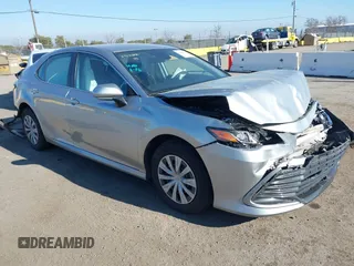 2022 Toyota Camry Hybrid LE with VIN 4T1C31AK2NU578509, listed as a IAAI auction lot 41443335 with 126,365 mi miles. Bid and sale history available at carsss.com. Image 1.