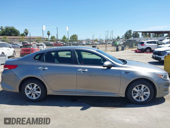 2016 Kia Optima LX with VIN 5XXGT4L36GG098804, listed as a IAAI auction lot 42772231 with 206,471 mi miles and . Bid and sale history available at DreamBid. Image 14.