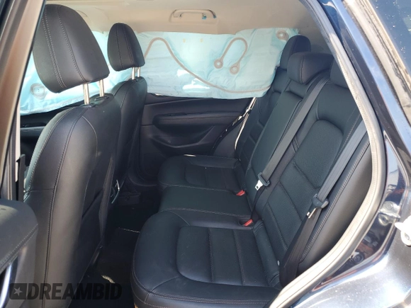 2018 Mazda CX-5 Grand Touring z VIN JM3KFADM5J1420690, wystawiony jako Copart lot #56897875 z przebiegiem 46 483 mil mil oraz Szkoda całkowita • Salvage title. Historia ofert i sprzedaży dostępna na DreamBid. Obrazek 10.