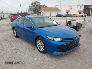 2020 Toyota Camry LE with VIN 4T1L11AK5LU310671, listed as a IAAI auction lot 41732306 with 61,379 mi miles and . Bid and sale history available at carsss.com. Image 1.