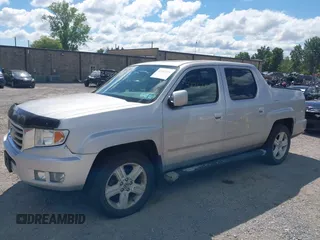 2013 Honda Ridgeline RTL with VIN 5FPYK1F51DB007236, listed as a IAAI auction lot 42762126 with 201,758 mi miles and . Bid and sale history available at DreamBid. Image 18.