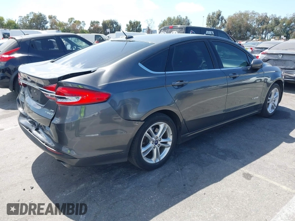 2018 Ford Fusion Hybrid SE with VIN 3FA6P0LU4JR261594, listed as a IAAI auction lot 40360797 with 128,533 mi miles. Bid and sale history available at carsss.com. Image 4.
