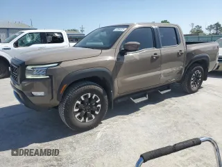 2023 Nissan Frontier Pro-4X z VIN 1N6ED1EK0PN668109, wystawiony jako Copart lot #57064975 z przebiegiem 6 406 mil mil oraz Szkoda całkowita • Salvage title. Historia ofert i sprzedaży dostępna na DreamBid. Obrazek 1.