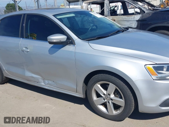 2012 Volkswagen Jetta TDI w/Premium with VIN 3VWLL7AJ8CM314305, listed as a IAAI auction lot 41885355 with 75,669 mi miles and . Bid and sale history available at DreamBid. Image 12.