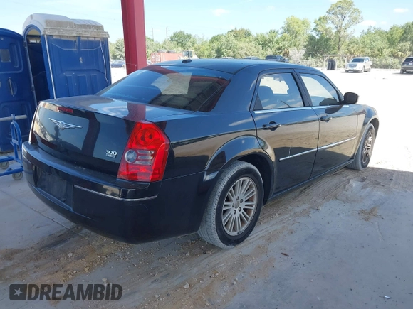 2009 Chrysler 300 Touring with VIN 2C3KA53V59H621936, listed as a IAAI auction lot 42112314 with 198,461 mi miles. Bid and sale history available at carsss.com. Image 4.