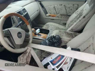 2004 Cadillac XLR z VIN 1G6YV34A445600668, wystawiony jako Copart lot #74595824 z przebiegiem Nie podano mil oraz Szkody całkowita. Historia ofert i sprzedaży dostępna na DreamBid. Obrazek 7.