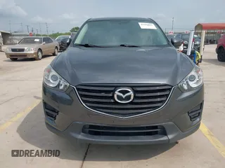 2016 Mazda CX-5 Sport with VIN JM3KE4BY8G0921243, listed as a IAAI auction lot 42102663 with 111,960 mi miles and . Bid and sale history available at DreamBid. Image 12.