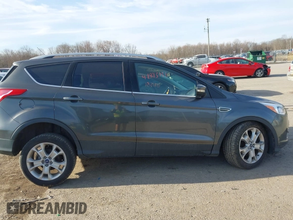 2015 Ford Escape Titanium with VIN 1FMCU9J90FUB58306, listed as a IAAI auction lot 41815151 with 136,835 mi miles. Bid and sale history available at carsss.com. Image 13.