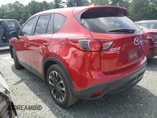 2016 Mazda CX-5 Grand Touring z VIN JM3KE2DY0G0722334, wystawiony jako Copart lot #59998185 z przebiegiem 51 449 mil mil oraz Szkoda całkowita • Salvage title. Historia ofert i sprzedaży dostępna na DreamBid. Obrazek 2.