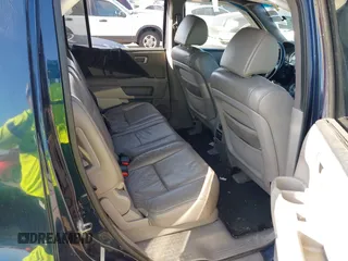 2011 Honda Pilot Touring with VIN 5FNYF4H92BB090056, listed as a IAAI auction lot 42010682 with 201,640 mi miles. Bid and sale history available at carsss.com. Image 8.