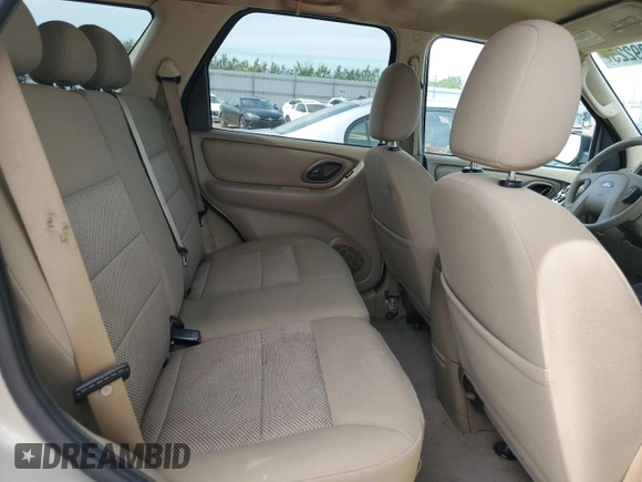 2005 Ford Escape XLT with VIN 1FMYU03165KC03784, listed as a Copart auction lot 64299225 with 185,033 mi miles and Salvage title. Bid and sale history available at DreamBid. Image 11.