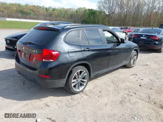 2014 BMW X1 sDrive28i with VIN WBAVM1C51EVW51040, listed as a IAAI auction lot 41956856 with 1 mi miles. Bid and sale history available at carsss.com. Image 4.