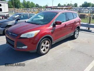2015 Ford Escape SE with VIN 1FMCU0G72FUC31709, listed as a IAAI auction lot 42135657 with 157,952 mi miles. Bid and sale history available at carsss.com. Image 2.