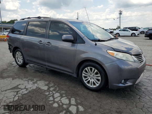 2014 Toyota Sienna XLE with VIN 5TDYK3DC6ES456558, listed as a Copart auction lot 63106085 with 231,260 mi miles and Salvage title. Bid and sale history available at DreamBid. Image 4.